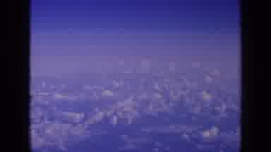 London England (1963): Beautiful View Of A Blue Cloud Filled Sky Through An