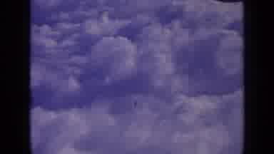 London England (1963): Aerial View Of Puffy White Clouds On A Bright Sunny Day