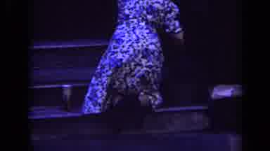 London England (1963): Woman Wiping Down Bench Outside Wearing A Blue Floral Dress