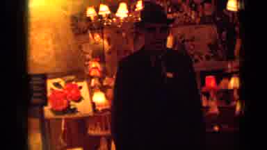 London England (1963): Man Looks Like He's In The Mafia Talking To Someone