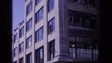 London England (1963): Old Time Footage Of Two Multi Story Buildings In A City