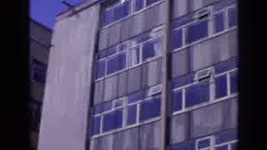 London England (1963): Front Of A Tall Building With Many Windows Being Filmed