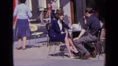 London England (1963): Couple Talking In Cafe In The City Center On Sunny Day