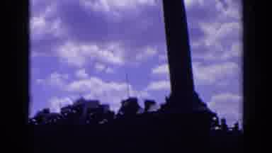 London England (1963): Tall Monument In A City Then Showing A Large Fountain