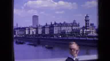 London England (1963): Panning Shot Of Old City Skyline With Large River And Boats