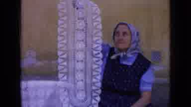 RUSSIA-1963: Woman Holds Up Her Handmade Doily Then Shows Colorful Ones In A
