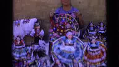 Russia (1963): Woman Displaying Homemade Dolls