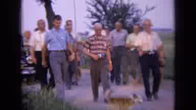 Russia (1963): A Group Of Gentlemen Walking On A Street In A Country Town And Some