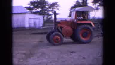 Russia (1963): Farming With A Red Tractor In A Sunny Day With Flowers All Around