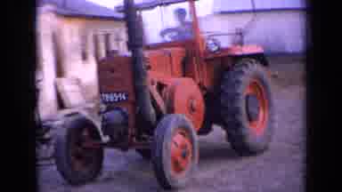 Russia (1963): By Driving Red Tractor Into Farmyard Surrounded By Brick Buildings