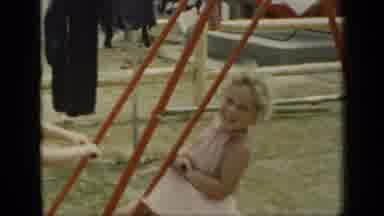 New York (1948): Two Children Swinging On An Outdoor Playset And A Cutaway Shot Of