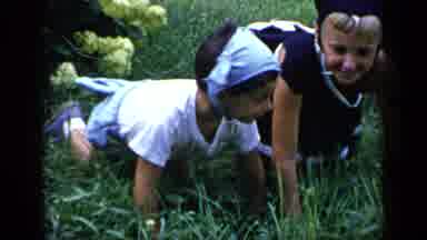 New York-1948: Two Little Girls Crawling On The Wild Grass