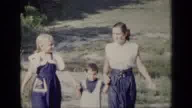 New York (1948): Two Sisters Holding Brothers Hands As They Walk With Him Towards