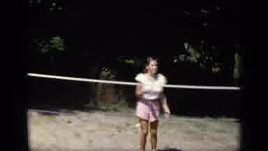 New York (1948): Young Girl Enjoying A Game Of Badminton In A Field With Her