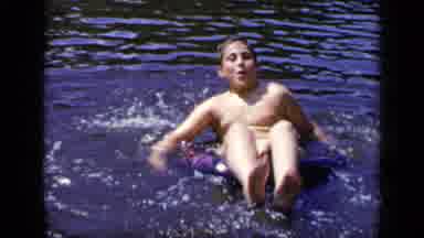New York (1948): Kid Floating On The Water Sitting On A Water Float