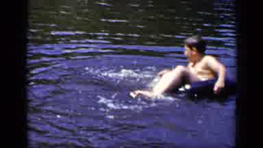 New York (1948): Two Kids Sitting On Water Floats Playing On A Lake Having Fun