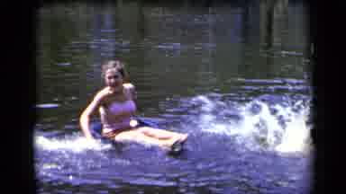 New York (1948): Girl Plays In The Water With Her Brother In A Desolate And Hot