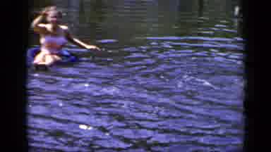 New York (1948): Two Young Kids Swimming And Playing On Inner Tubes In The Water