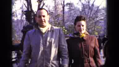New York (1948): Man And Woman Walking In Park While Young Child Feeds Pigeons