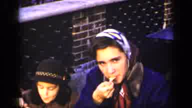 New York (1948): Women In Colorful Scarves Child In Hat Eating A Treat Outside On