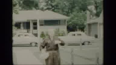 New York (1948): An Empty Yard Then A Man Walking Down A Walk Touching His Shirt
