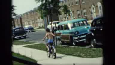 New York (1948): Shirtless Boy Coasts One Way On Bike And Pedals The Other Way