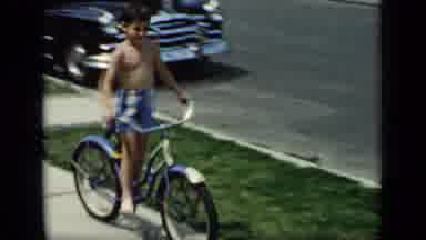 New York (1948): Children Riding Bicycles On Sidewalk In Residential Street On