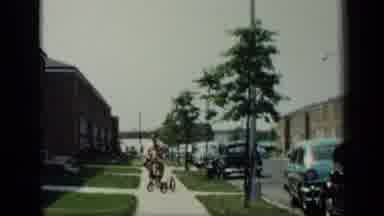 New York (1948): Father And Son Riding Bicycle Down A Sidewalk