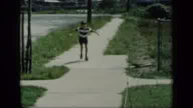 New York (1948): Kid Roller Skating Down The Sidewalk Toward Camera