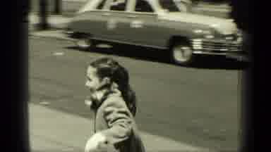 New York (1949): Very Euphoric Girl Strolling With Her Mother On The Sidewalk Of A