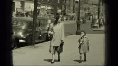 New York (1949): Woman Walking Quietly With Her Daughter On Sidewalk Beside Busy