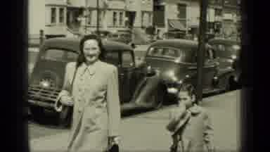 New York (1949): Woman Looks At Camera Then Looks At Little Girl As They Stroll