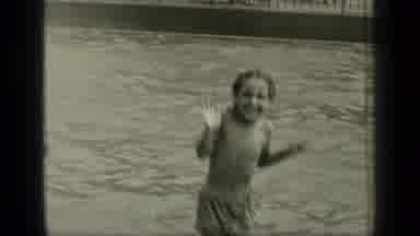 New York (1949): Little Girl Jumping And Playing In Shallow Water Before Joining