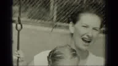 New York (1949): A Women And A Baby On A Swing Set During The Day While It Being