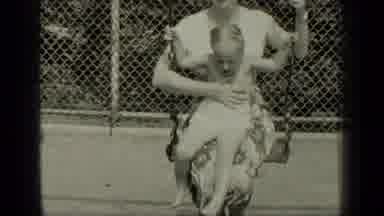 New York (1949): Mom Sitting On Swing Holding Her Daughter Swinging With Each
