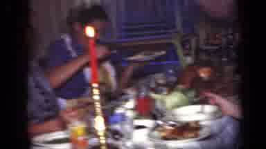 New York (1949): Woman Wearing Blue Dress Waves At Camera During Meal At Red