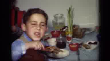 New York (1949): Boy Wearing Blue Shirt Eats Turkey Drumstick While Girl Wearing