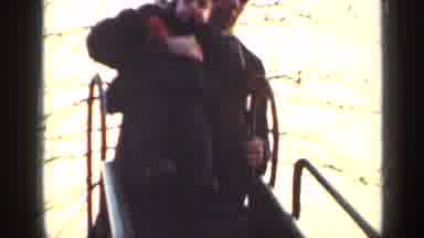 New York (1949): Man And Boy With Hat And Warm Coat Sliding Down A Slide Near A