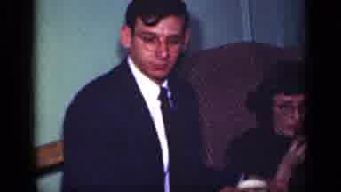 New York (1949): Family And Parents Observing Excited Child At Gathering Inside