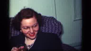 New York (1949): Women Wearing Black Dresses Sit In Grey Sofa Talking And Laughing