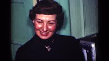 New York (1949): Woman Smiles Brightly As Camera Pans To The Two Others Nearby