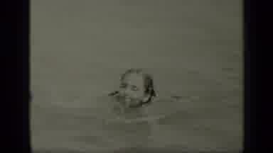 New York (1949): Girl With Pig-Tails Dog-Paddling In The Water Towards The Camera