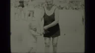 New York (1949): A Women Appears Holding The Hand Of A Small Girl On A Beach Then