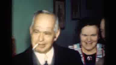 New York (1949): Old People Wearing Suits Walking Inside A Building While Smiling