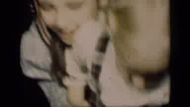 Kids pose for the camera while Mom perfects her hair-flip-flop!