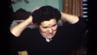New York (1949): Older Woman Adjust Hair While Two Girls Dance In Front Of Her