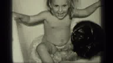 New York-1957: Home Video Of A Small Child Bathing In Black And White