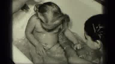 New York (1957): Two Young Girls Sit Laugh And Play In A Tub While An Adult Washes