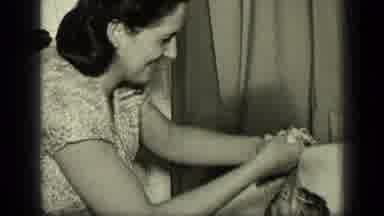 New York (1957): Mother Bathing Baby And Washing Hair Recorded On An Old Video In