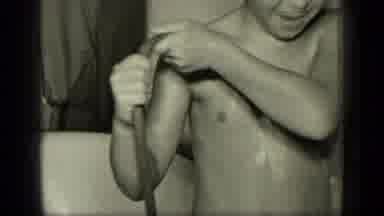 New York (1957): A Young Girl Bathing Herself With Pipe Water In A Bathtub
